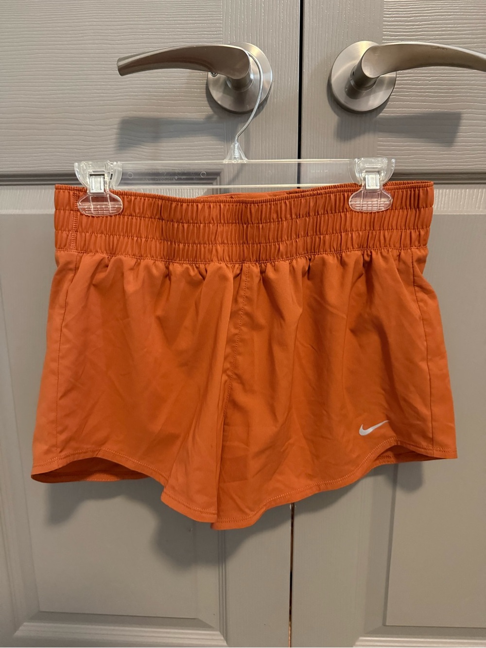Nike Women's High-Waisted Dry-FIT Shorts in Burnt Orange, size Medium